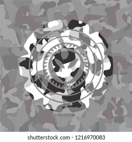 alien icon on grey camouflaged pattern