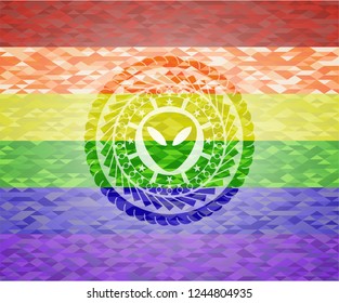 alien icon on mosaic background with the colors of the LGBT flag