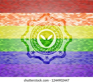 alien icon on mosaic background with the colors of the LGBT flag