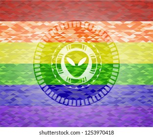 alien icon on mosaic background with the colors of the LGBT flag