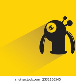 alien monster with shadow on yellow background