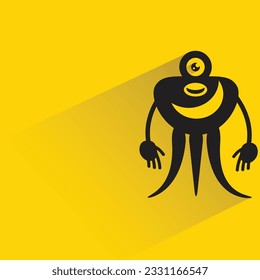 alien monster with shadow on yellow background