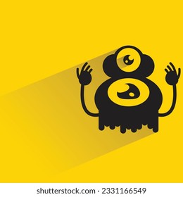 alien monster with shadow on yellow background