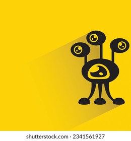 alien monster with shadow on yellow background