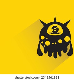alien monster with shadow on yellow background