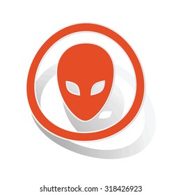 Alien sign sticker, orange circle with image inside, on white background