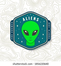 Aliens. Humans are not alone. Patch. Vector illustration. Concept for shirt, print, stamp, overlay or template. Vintage typography design with alien and the space silhouette.