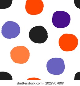 All over Halloween seamless repeat pattern with big bold red irregular rough edge hand-drawn polka dots tossed on a white background