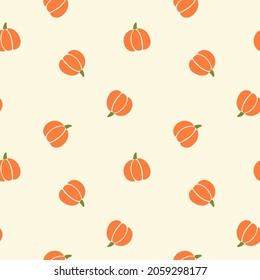 All over Halloween seamless vector repeat pattern with tossed orange and green pumpkin silhouettes on cream background. Simple and sophisticated 4 way harvest Thanksgiving backdrop