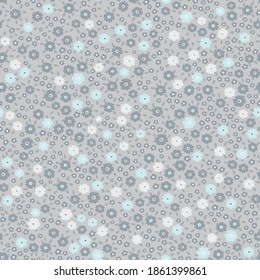 All over neutral retro ditsy floral seamless repeat pattern packed with many tiny small flowers and leaves in gray, blue and white colors