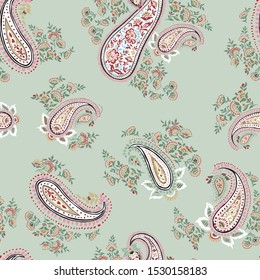 all over seamless paisley pattern on green background