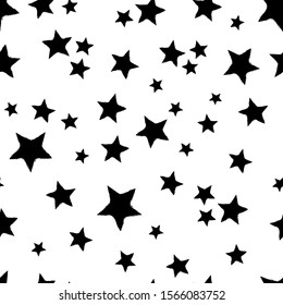 All over seamless repeat pattern with tossed black hand drawn sketched stars on a white background