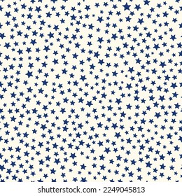 All over seamless repeat pattern with ditsy tiny little dark navy blue stars on cream. Versatile trendy ditsy background