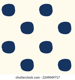 All over seamless repeat pattern with dark navy blue polka dots with grunge edges half drop on cream. Versatile trendy modern background
