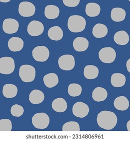 All over seamless repeat pattern with big gray polka dot on navy blue with grunge edges. Versatile trendy modern background with tossed dots