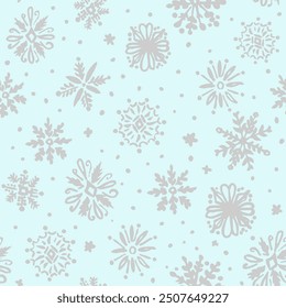 All over seamless repeat pattern with hand drawn ornate silver snowflakes tossed on soft mint blue background