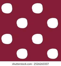All over seamless repeat pattern with white polka dots with grunge edges half drop on deep burgundy red. Simple versatile background for Christmas and everyday wrap, packaging, fabric, wallpaper.