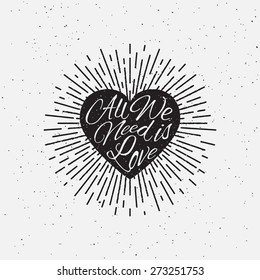 'All We Need is Love' vintage grunge hand lettering with heart and rays for t-shirt apparel, print, poster, card design etc. Vector Illustration.