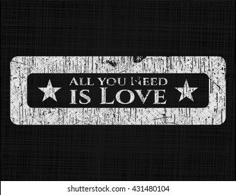 All you Need is Love chalkboard emblem written on a blackboard