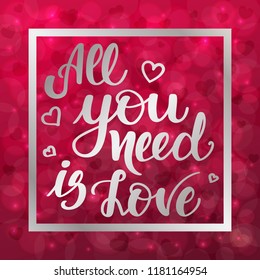 All you need is love. Motivational and inspirational handwritten lettering on blurred bokeh background with hearts. Vector illustration for posters, cards and much more.