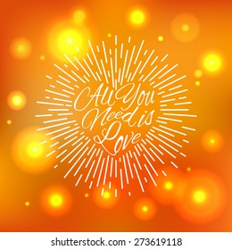 'All You Need is Love' vintage hand lettering on the bright colored sparkling blur background for print, poster, card design etc. Vector Illustration.