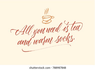 All you need is tea and warm socks lettering phrase. Brush pen calligraphy. Warm colors. 