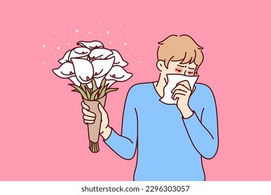 Allergic man holding bouquet flowers and using handkerchief suffering from pollen in need of allergy medicine. Everyday guy allergic with lilies wanting to make romantic gift suffers from runny nose