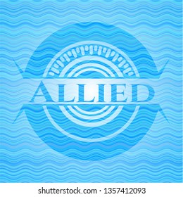 Allied light blue water wave style badge.