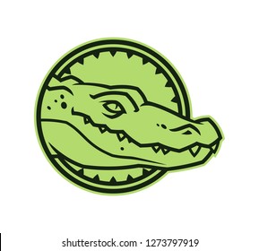 Alligator head in circle. Crocodile character icon