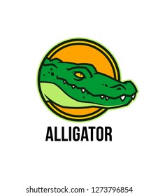 Alligator head in circle. Crocodile colored mascot