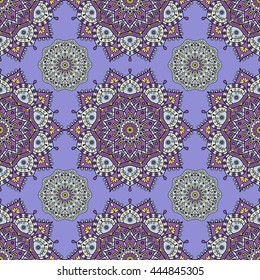 All-over medallion design in purple, pale aqua blue & yellow on periwinkle blue background. Seamless mandala medallion pattern with oriental & boho motifs. Ethnic print for bedding set, tapestry, rug.