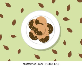 Almond chocolate cookies in white plate and sprinkle with almonds on green table vector.