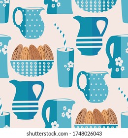 Almond milk vector seamless pattern background. Backdrop of brown oval nuts in bowls with pretty blue jugs and glasses. Hand drawn all over print for healthy drink alternative, nutrition concept