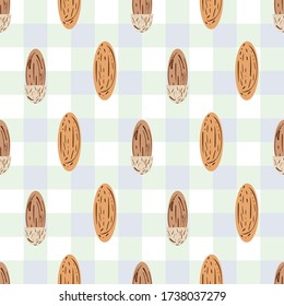 Mandelvektor nahtlos Muster Hintergrund. Hellbraune, ovale Nüsse auf pastellblauen Gingham Tuch Hintergrund. Das Design der Kernel-Samenschalen ist zusammengesetzt. Alles für Lebensmittel, Süßwaren, Ernährungskonzept