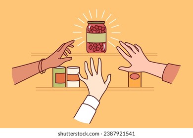 Almost empty shelf in supermarket and hands of people rushing to pick last can of scarce goods. Panicked grocery store customers stock up on scarce merchandise as storm warnings are issued 