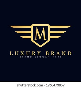 Alphabet capital logo creative design luxury concept with wings ornament silhouette for initial business identity with hidden letter M