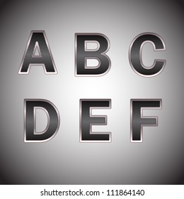 Alphabet of carbon fiber in a metal frame.