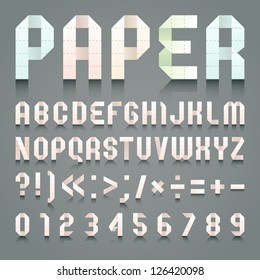 Alphabet folded of toilet pink paper. Roman alphabet & Arabic blue numerals (A, B, C, D, E, F, G, H, I, J, K, L, M, N, O, P, Q, R, S, T, U, V, W, X, Y, Z, 0, 1, 2, 3, 4, 5, 6, 7, 8, 9).