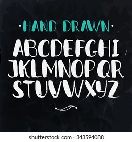 Alphabet. Hand drawn letters isolated on dark background. Colorful vector illustration. Design elements for scrapbooking.