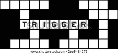 Alphabet letter in word trigger on crossword puzzle background