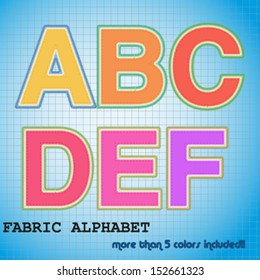 alphabet LETTERS  A B C D E F made of clothe patches. Multiple colors