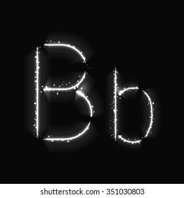 Alphabet letters of white lights on dark background
