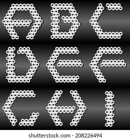 Alphabet made with metal nuts. First part of collection.