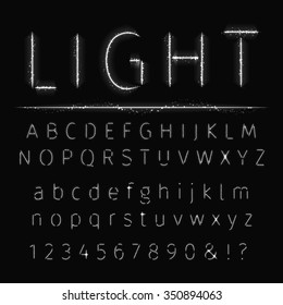 Alphabet of white lights on dark background. Unusual Alphabet. Shine Font. White Sparkle Font. Unique Shine Vector Alphabet.  Unusual Vector Font.