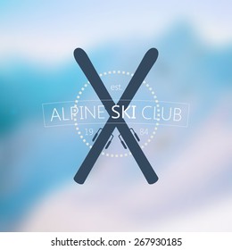 Alpine Ski Club Logo Over Blurred Nature Background