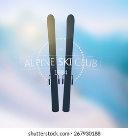 Alpine ski club logo over blurred nature background with sun