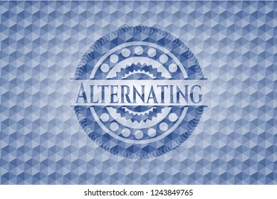 Alternating blue emblem with geometric pattern background.