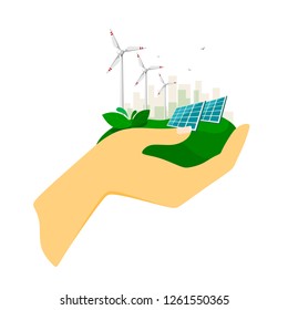 Alternative energy sources, solar panels and wind turbines with the city in the background in human hand. Eco-friendly energy