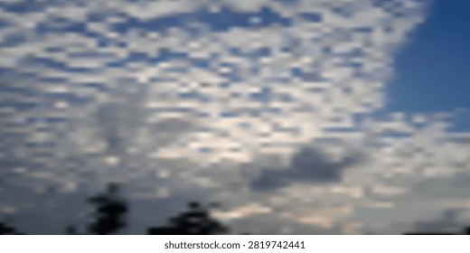 Altocumulus clouds form a rippled, textured sky above silhouetted trees at dusk, creating a peaceful, atmospheric scene ideal for weather, nature, background, and landscape concepts.

