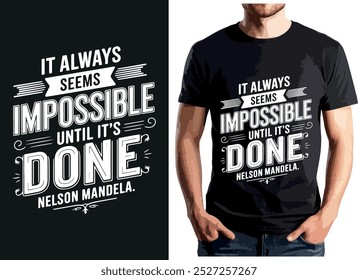 It always seems impossible until it's done" design with bold white text, banners, and decorative flourishes. Stylish motivational message displayed on a black t-shirt, ideal for those embracing.